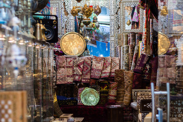 Market or Bazzar in Old City of Jerusalem. Traditional products, carpets and souvenirs in antique shop. Israel.