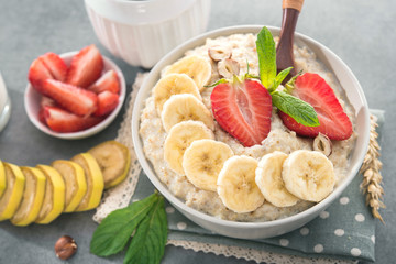 Oatmeal bowl  with banana and strawberry