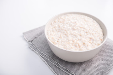 Healthy food classic porridge in white bowl