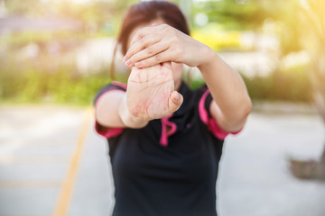 Women exercising. Young fitness woman exercising in sunny bright light in the morning. Closeup of...