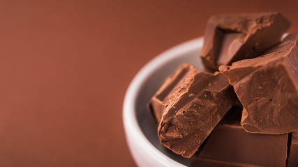 Pieces of chocolate in a white bowl