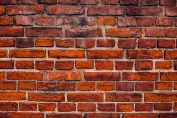 Naklejka premium Red bricks wall background. Old building surface