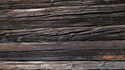Textura de madera antigua oscura en con grietas y nudos