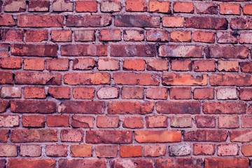 Fototapeta premium Red bricks wall background. Old building surface