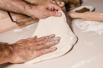 A working day at the bakery - the baker prepares the dough for baking - an interesting and tasty profession