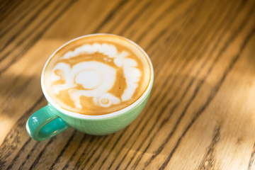 Italian cafe, turquoise color of cappuccino coffee cup