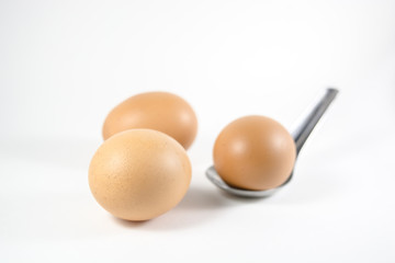 three eggs in a bowl