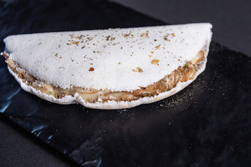 Jerky tapioca in black table - typical brazilian dish
