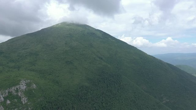 Clouds over the top of the mountain Rtanj by early morning 4K drone video