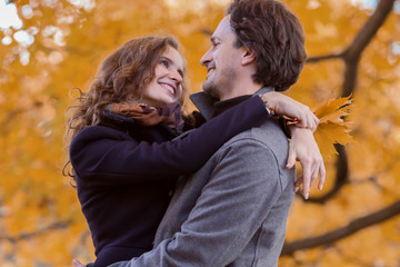 Couple hug in autumn park