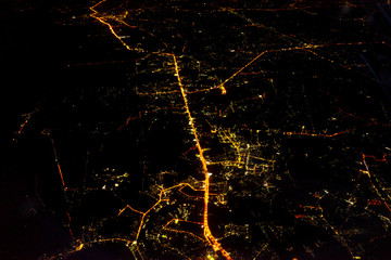 a night city from an airplane.
