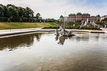 Deurstickers old big baroque fountain made of white marble. Beautiful fountain with antique sculptures in the park © Konstantin