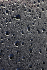 Fototapeta na wymiar Drops of water liquid on glasses surface