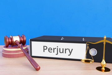 Perjury – Folder with labeling, gavel and libra – law, judgement, lawyer