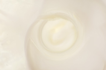 Fototapeta na wymiar Bright milk background with splashes
