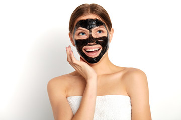 young woman looking up rejoicing at new mask, close up portrait, studio shot,isolated white background, lifestyle