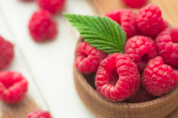 Fresh and natural raspberry with mint on a wooden table