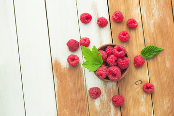 Fresh and natural raspberry with mint on a wooden table