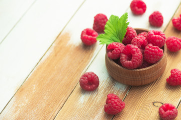 Fresh and natural raspberry with mint on a wooden table