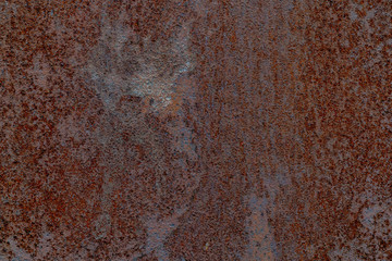 Rusty metal texture. Brown and gray colours of rust. Rough surface. Background for text or design
