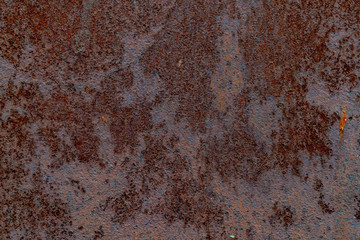 Rusty metal texture. Brown and gray colours of rust. Rough surface. Background for text or design