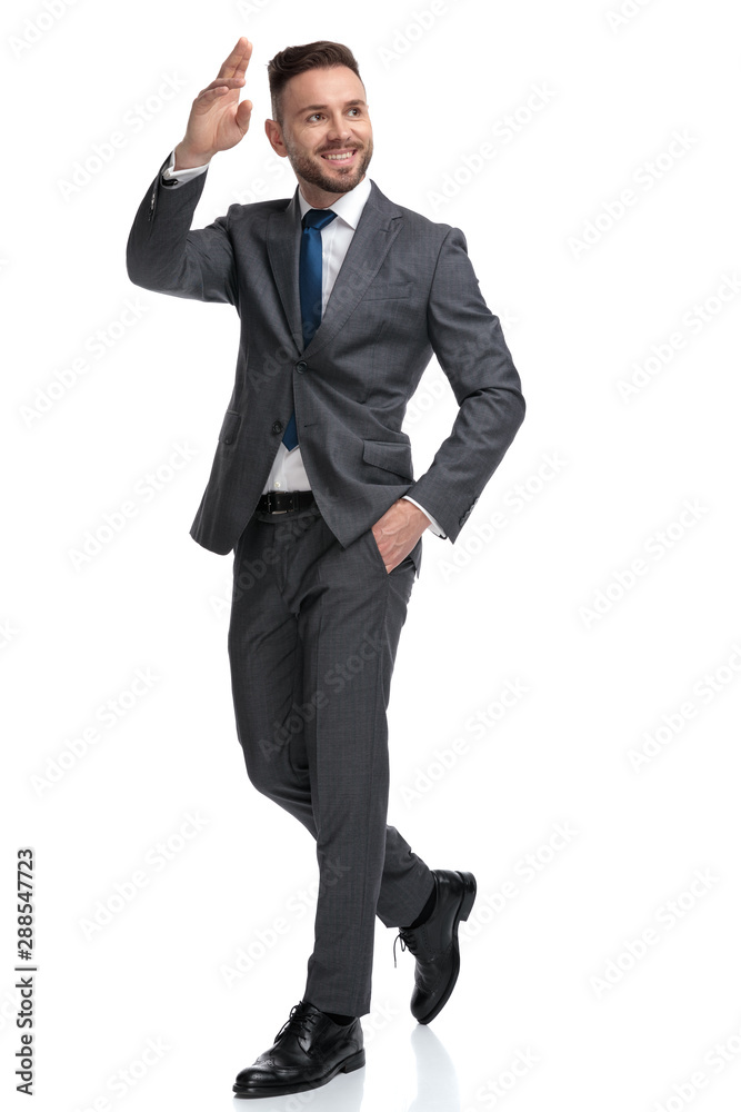 Sticker smiling young businessman waving his hand and greets someone,