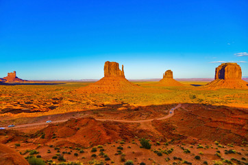 View of Monument Valley at sunset near the border of Arizona and Utah in Navajo Nation Reservation in USA.