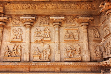 sculptures in the wall of ancient Hindu temple in the ruins in Hampi India