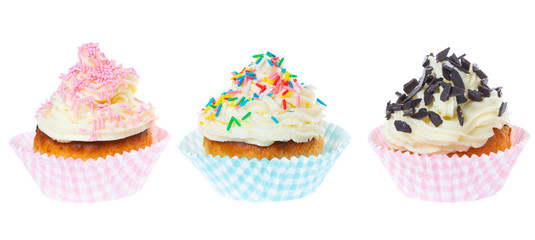 three cupcakes with butter cream decorated sprinkles isolated on white background, panorama