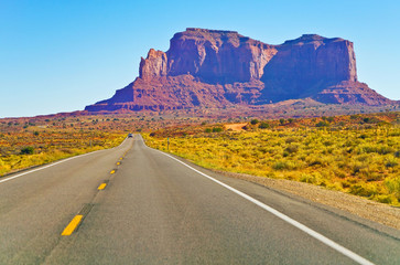 Fototapeta na wymiar View of Monument Valley on a sunny day on the Highway 163 in Navajo Nation Reservation in USA.