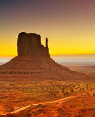 Fototapeta na wymiar View of Monument Valley at sunrise near the border of Arizona and Utah in Navajo Nation Reservation in USA.