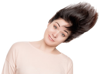 funny girl with dark hair on white background. woman playing with her hair