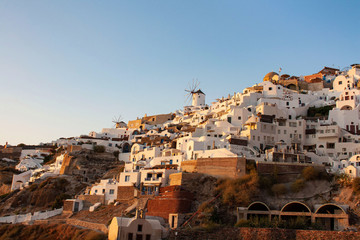 Fototapeta premium View of Oia the most famous village of Santorini Island in Greece with white houses and windmills