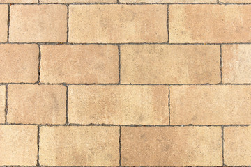 Obraz premium yellow rectangular stone of modern paving slabs, background, texture