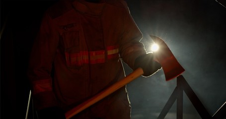 Fire fighter holding axe