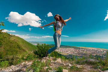 Fototapeta premium Woman jumping in view Black sea