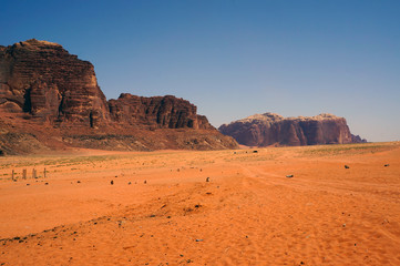Fototapeta na wymiar The Martian landscape of the desert surrounding Wadi Rum, in southern Jordan