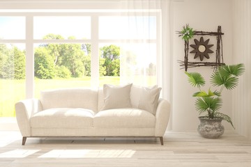 Stylish room in white color with sofa and summer landscape in window. Scandinavian interior design. 3D illustration
