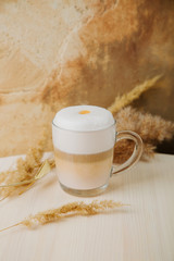 Pumpkin Spice Latte. Cup of Latte with   Fall Decor. Traditional Autumn Coffee Drink.