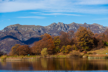 Fototapeta premium Beautiful landscape with Tsover lake and arrounded mountains and trees, Armenia