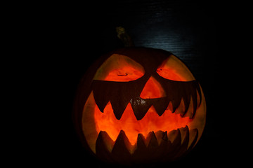 Spooky halloween pumpkin on a black background