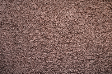 Pale subdued flat tone bronze textured background.
