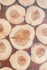 Wooden texture of the table top for cooking with a pattern of round logs