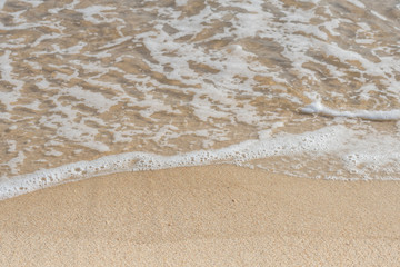 Fototapeta na wymiar Close Up of Ocean Ripples on Beach