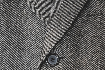 Dark grey tweed coat close up