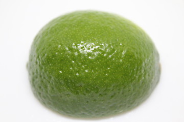 Outside of a half a Lime Fruit with a white background