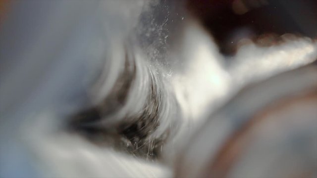 Conveyor production line for synthetic winterizer in slow motion. Sintepon production, sintepon production process. synthetic winterizer close-up slow motion.