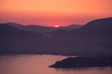Sunset on the sea among the beautiful mountains, the Adriatic Sea. Montenegro.