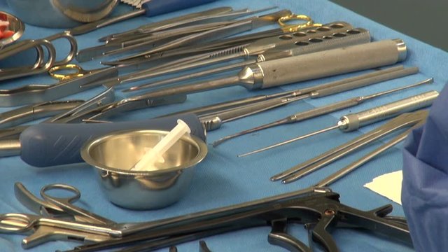 surgical instruments and tools on the table in the operating room