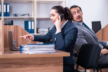 Two employees working in the office